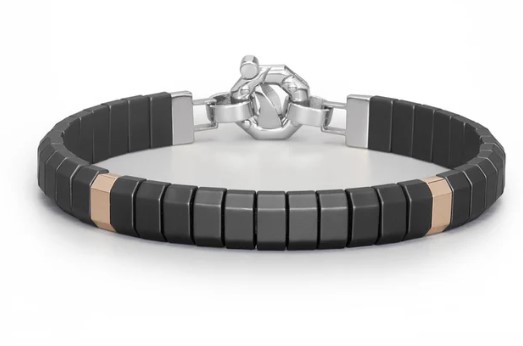 A black ceramic bracelet in rose gold, sterling silver, and titanium.