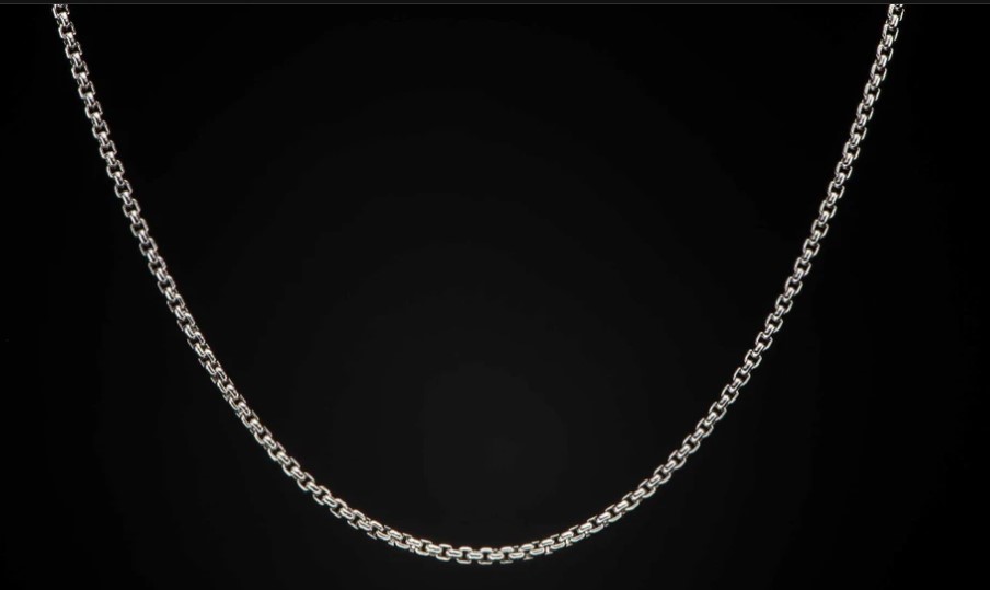 A silver chain box necklace.