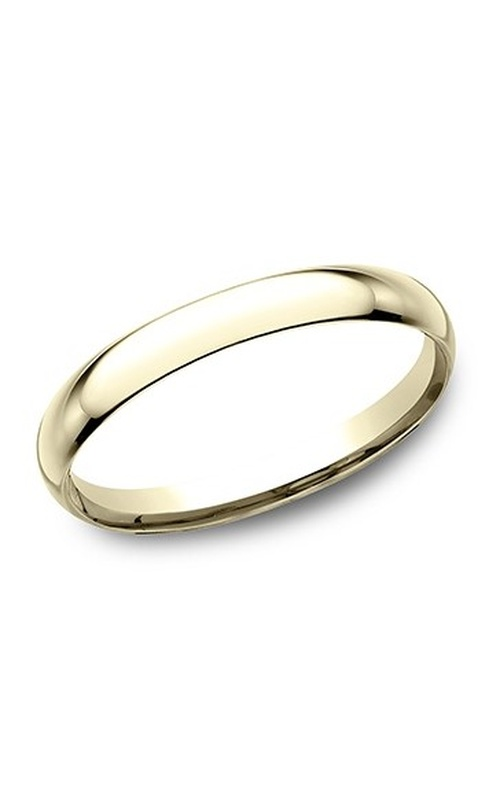 A polished yellow gold wedding band paired with a yellow gold engagement ring featuring a marquise cut centerpiece.