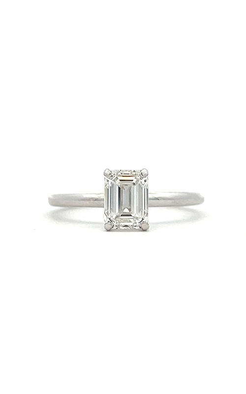 A white gold emerald cut engagement ring and contour white gold wedding band with round diamonds.