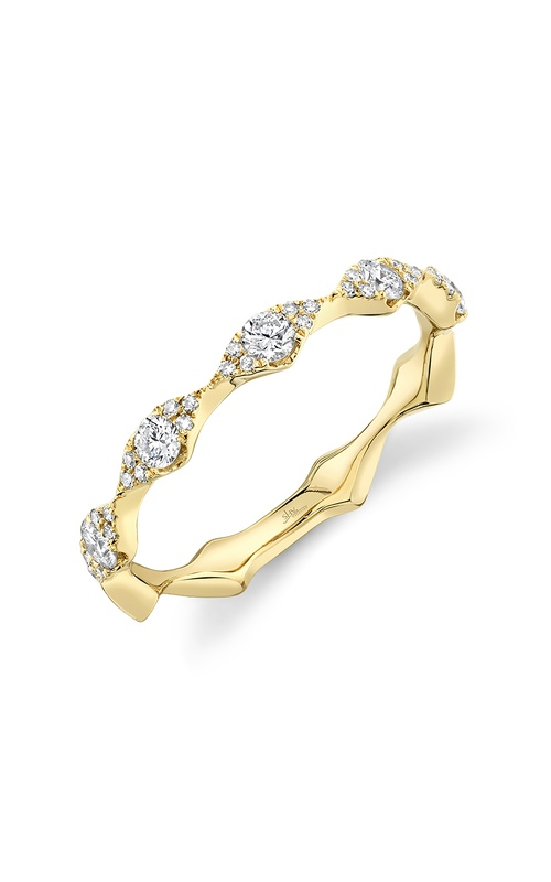 A rose gold diamond side stone engagement ring paired with a yellow gold diamond wedding band.