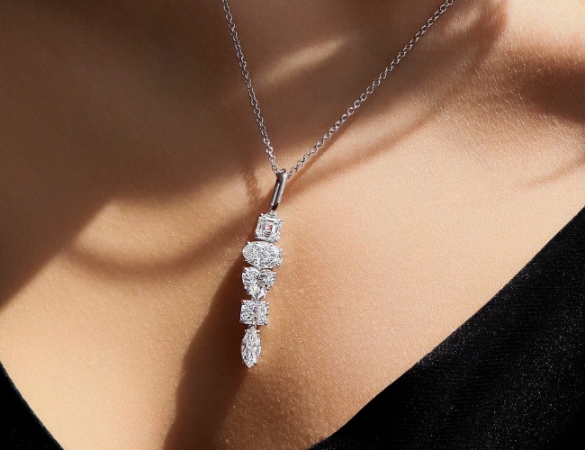 An impressive white gold and diamond journey necklace of varying diamond shapes