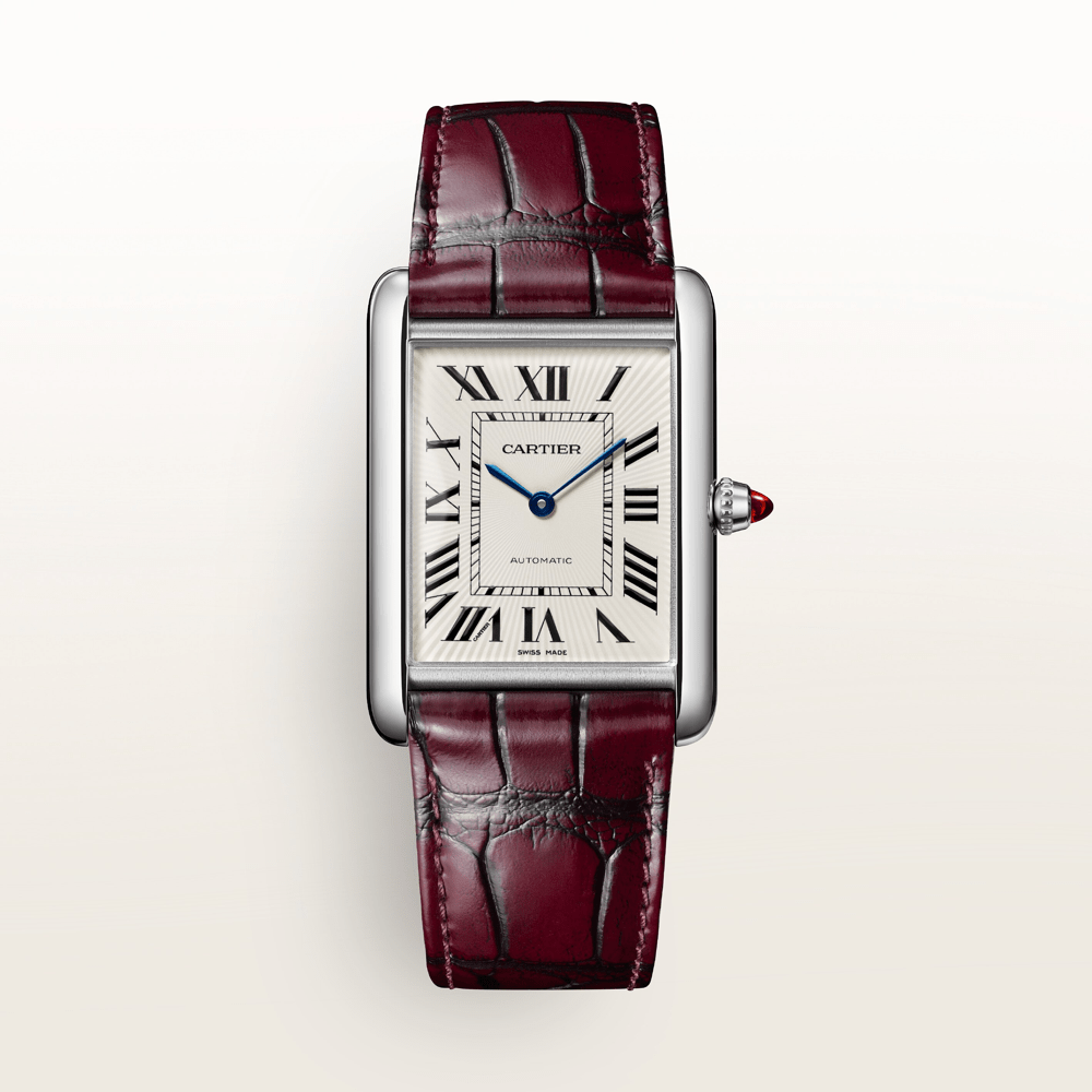 A Cartier Tank watch with a silver rectangular case, white dial, black Roman numerals, and a maroon alligator leather strap.