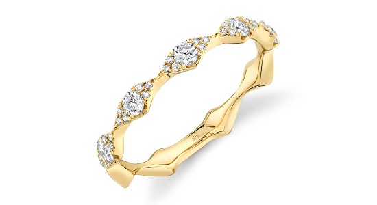 a yellow gold diamond wedding band with a unique silhouette