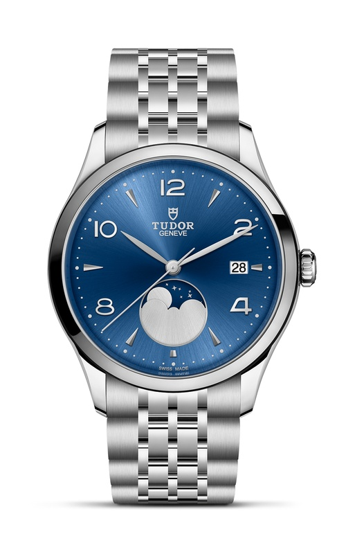 A TUDOR stainless steel watch with deep blue dial, moonwatch complication and arab numerals and indexes.