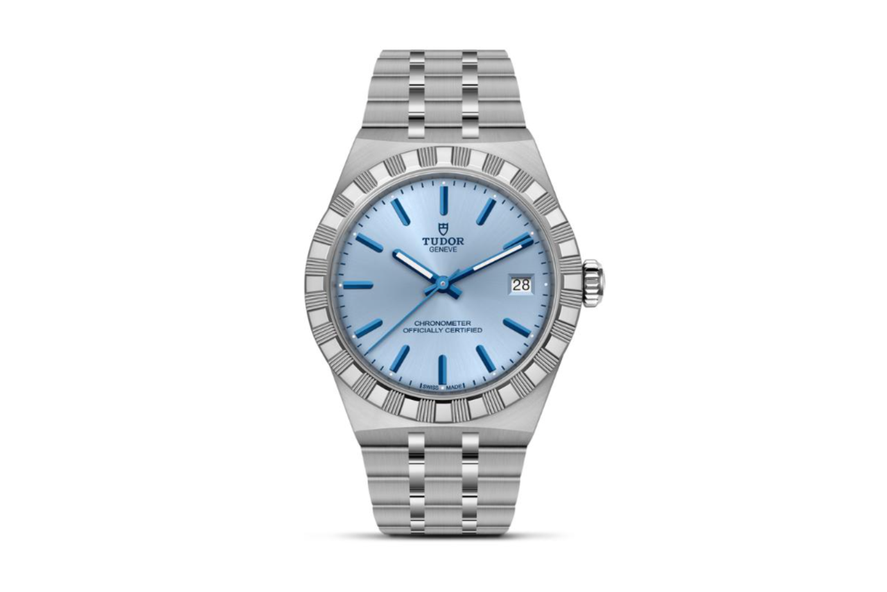 A TUDOR watch with a steel band, steel bezel, and light blue dial.