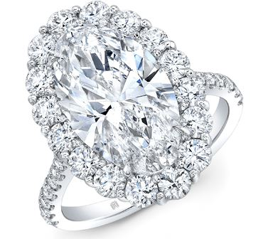 A white gold engagement ring with an elaborate halo and oval cut center stone, available at Heller Jewelers.