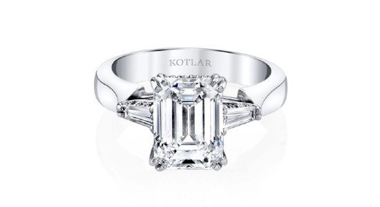 A platinum engagement ring with a large emerald cut center stone, available at Heller Jewelers.
