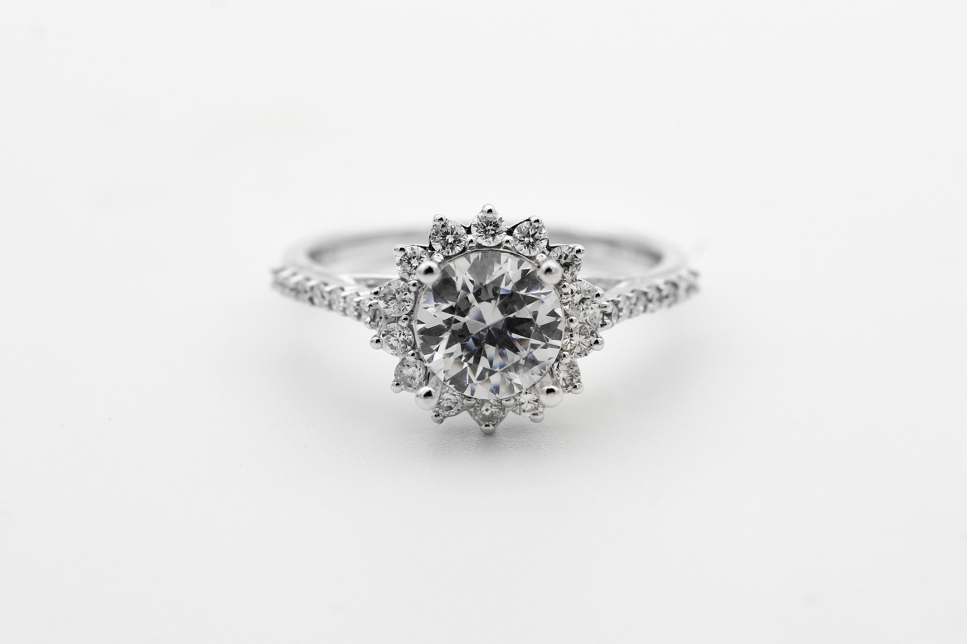 A view of a distinctive halo engagement ring with a sun motif. A view of a distinctive halo engagement ring with a sun motif.