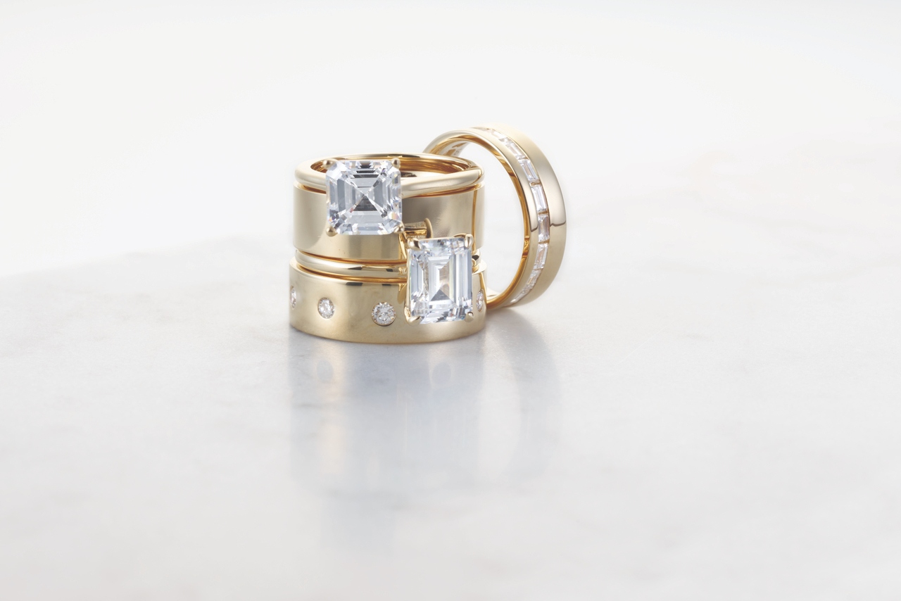 Engagement rings with thick, matching wedding bands and a channel set diamond and yellow gold band